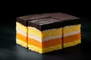 Delicious Battenberg Cake dark background with empty space for text photo