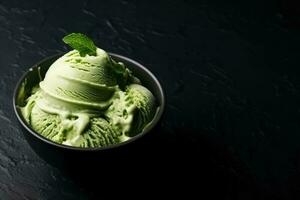 Delicious Matcha Green Tea Ice Cream dark background with empty space for text photo