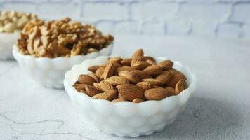a bowl of almonds and walnuts video