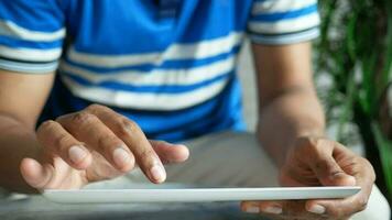 a man is using a tablet computer video