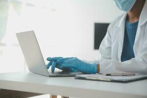 Professional lab. Amazing longhaired medical worker wearing uniform while using microscope during research photo