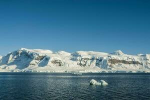 Sea and mountains landscape in Antarctica photo