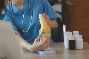 Asian doctor woman visited patient woman to diagnosis and check up health at home or private hospital. Female patient explain health problem and symptoms to doctor .Health care premium service at home photo