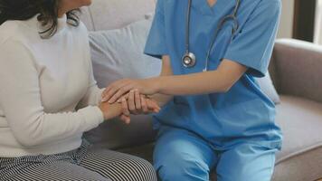 Asian doctor woman visited patient woman to diagnosis and check up health at home or private hospital. Female patient explain health problem and symptoms to doctor .Health care premium service at home photo