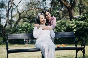Happy senior woman enjoying in daughter's affection on Mother's day. photo