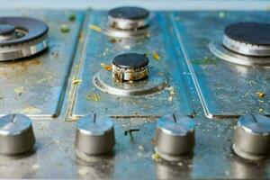 Dirty stove top with oil splatters, fat stains and food leftovers photo