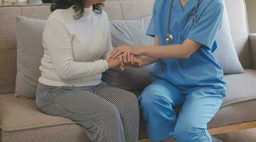 Close-up of stethoscope and paper on background of doctor and patient hands photo