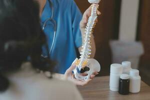 Close-up of stethoscope and paper on background of doctor and patient hands photo