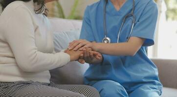 Close-up of stethoscope and paper on background of doctor and patient hands photo