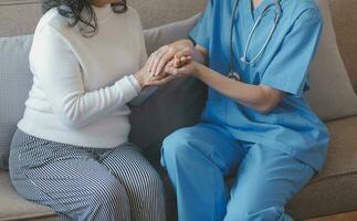 Close-up of stethoscope and paper on background of doctor and patient hands photo