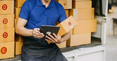 Business woman start up small business entrepreneur SME success .freelance woman working at home with Online Parcel delivery. SME and packaging deliveryconcept photo