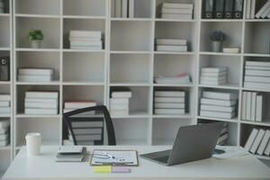 Shot of a asian young business Female working on laptop in her workstation. photo