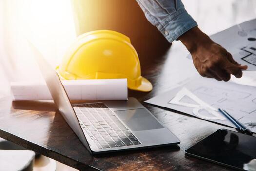 Construction and structure concept of engineer working drawing on blueprint meeting for project working with partner on model building and engineering tools in working site, construction concept. photo