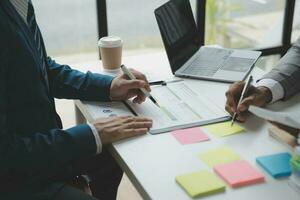 Audit concept,Administrator business man financial inspector and secretary making report calculating balance. Internal Revenue Service checking document. photo