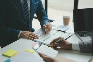 Audit concept,Administrator business man financial inspector and secretary making report calculating balance. Internal Revenue Service checking document. photo