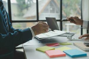 Audit concept,Administrator business man financial inspector and secretary making report calculating balance. Internal Revenue Service checking document. photo
