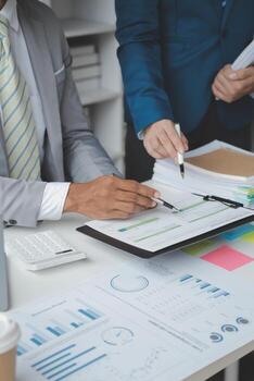 Close up of Business team analyzing income charts and graphs with modern laptop computer. Business analysis and strategy concept. photo