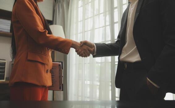 Financial analysts analyze business financial reports on a digital tablet planning investment project during a discussion at a meeting of corporate showing the results of their successful teamwork. photo