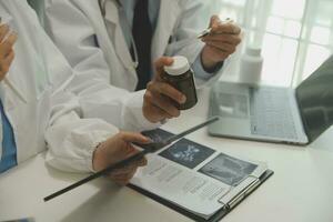 Doctor who records a patient's detailed information or medication history is evaluating medications and vaccines for the intended treatment. or if there are any side effects. photo