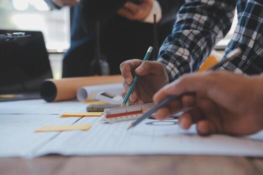 Construction and structure concept of Engineer or architect meeting for project working with partner and engineering tools on model building and blueprint in working site, contract for both companies. photo