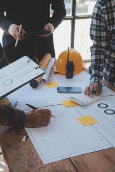 Construction and structure concept of Engineer or architect meeting for project working with partner and engineering tools on model building and blueprint in working site, contract for both companies. photo