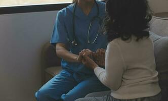 Mental health counselor. Young woman during therapy session talking with a psychologist in the office. photo