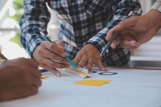 Construction and structure concept of Engineer or architect meeting for project working with partner and engineering tools on model building and blueprint in working site, contract for both companies. photo