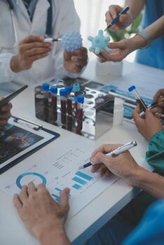 Medical technology network team meeting concept. Doctor hand working smart phone modern digital tablet laptop computer graphics chart interface, sun beams effect photo