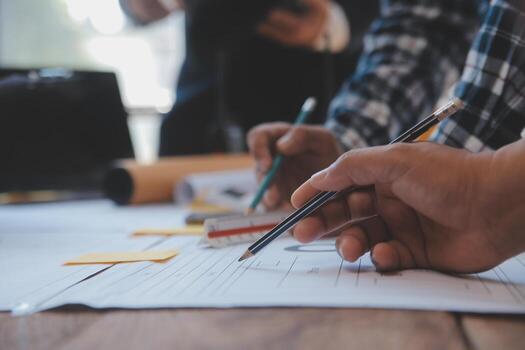 Engineer Teamwork Meeting, Drawing working on blueprint meeting for project working with partner on model building and engineering tools in working site, Construction and structure concept. photo