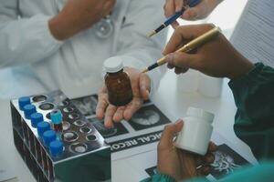 Cropped image of successful medical doctors discussing diagnosis during the conference photo