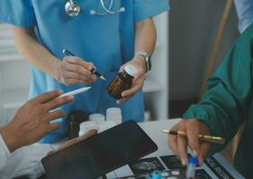 Cropped image of successful medical doctors discussing diagnosis during the conference photo