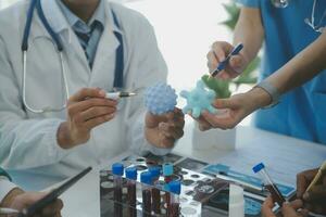 Cropped image of successful medical doctors discussing diagnosis during the conference photo