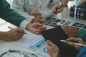 Cropped image of successful medical doctors discussing diagnosis during the conference photo