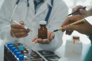 Cropped image of successful medical doctors discussing diagnosis during the conference photo