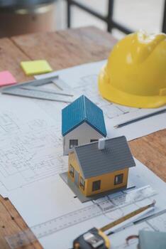 Engineer Teamwork Meeting, Drawing working on blueprint meeting for project working with partner on model building and engineering tools in working site, Construction and structure concept. photo