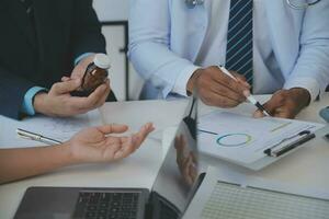 Cropped image of successful medical doctors discussing diagnosis during the conference photo