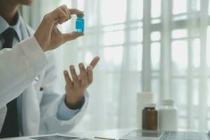 Shot of a female doctor working on medical expertise while sitting at desk in front of laptop. photo