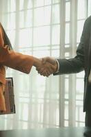 Business handshake for teamwork of business merger and acquisition,successful negotiate,hand shake,two businessman shake hand with partner to celebration partnership and business deal concept photo