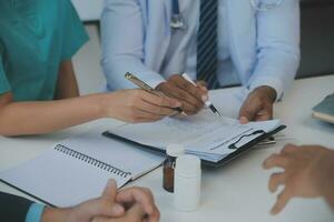 international team of professional doctors having a meeting in conference room at the modern hospital. Healthcare and medical development concept. photo