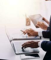 Businessman working on a laptop computer to document management online documentation database digital file storage system software records keeping database technology file access doc sharing. photo