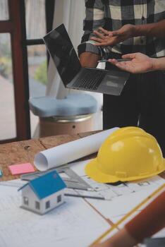 Engineer Teamwork Meeting, Drawing working on blueprint meeting for project working with partner on model building and engineering tools in working site, Construction and structure concept. photo
