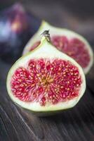 Fresh figs on the wooden background photo