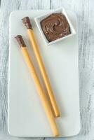 Breadsticks with chocolate cream photo