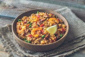 Bowl of chicken and chorizo paella photo