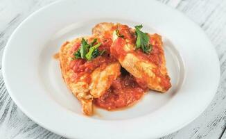 Chicken in tomato garlic sauce photo