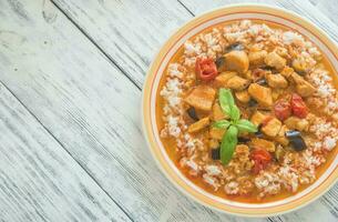 Thai red chicken curry with white rice photo