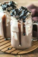 Two mugs of hot chocolate with marshmallows photo