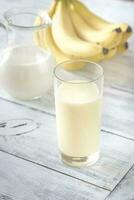 Glass of banana milk shake photo