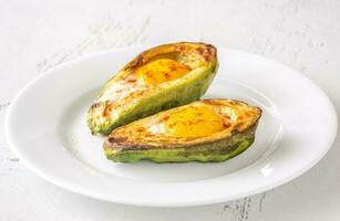 Baked eggs in avocado photo