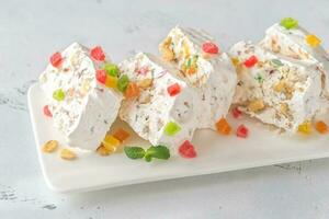 White nougat with fresh mint leaves photo